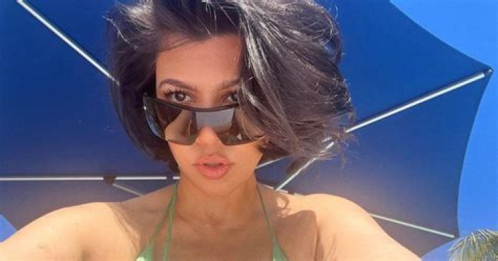 Kourtney Kardashian Pairs Her Bikini Top With Ripped Jeans While Posing By The Beach — Photo