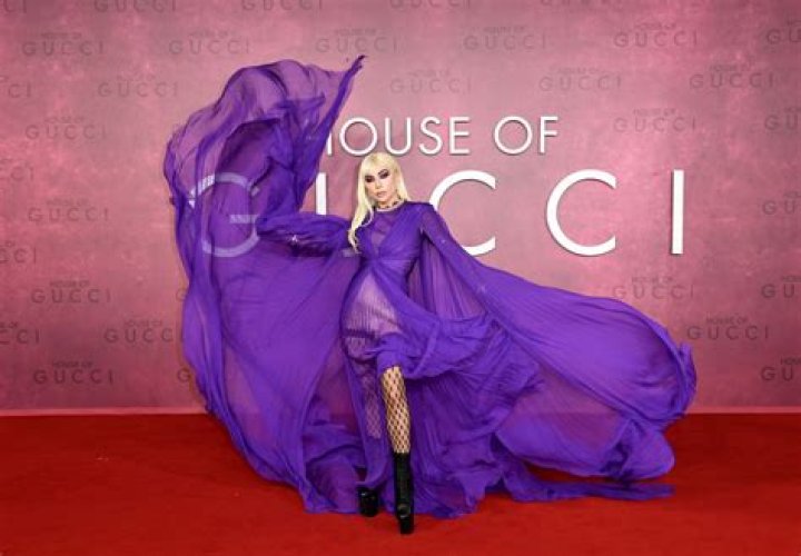 Lady Gaga Slays In Sheer Purple Slit Dress With Fishnets At ‘House of Gucci’ Premiere – Photos